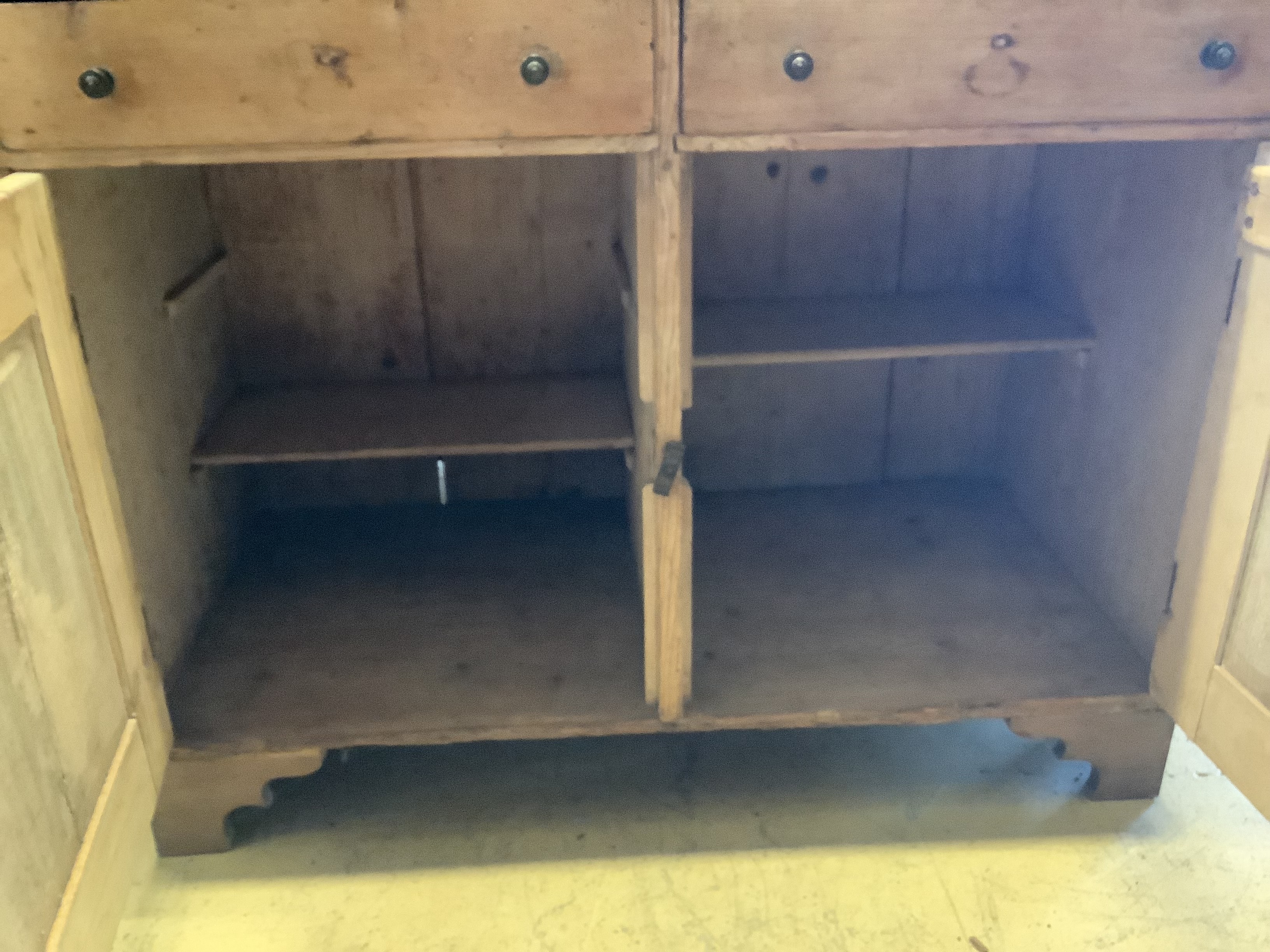 A stripped pine bureau